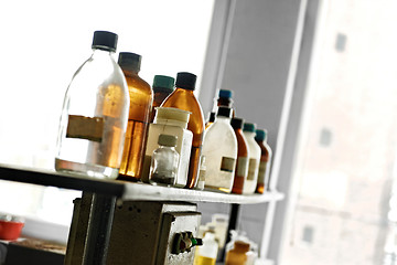 Image showing Photo of an old laboratory with a lot of bottles