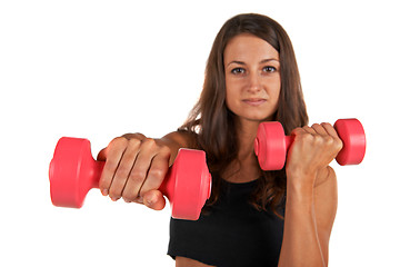 Image showing Young woman in the studio with weights