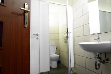 Image showing Opened door with toilet