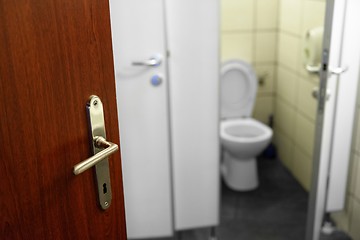 Image showing Opened door with toilet