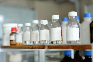 Image showing Photo of an old laboratory with a lot of bottles