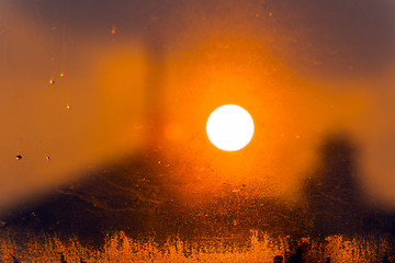 Image showing Frosted window with sun