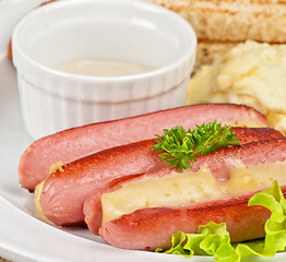 Image showing sausages with cheese and omelette