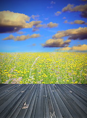 Image showing old wood floor and field with flowers