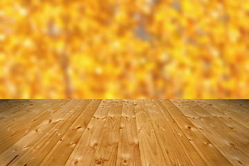 Image showing wooden floor and defocused autumn forest