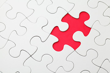 Image showing Missing puzzle piece in red 