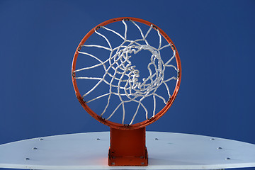 Image showing Orange basketball hoop and the blue sky