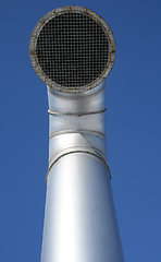 Image showing Shiny metallic ventilation pipe with wire mesh
