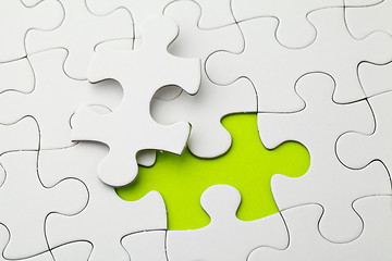 Image showing Puzzle with missing piece in green color