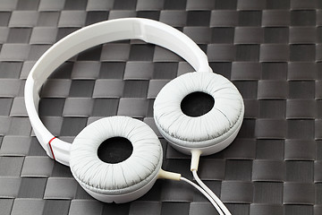 Image showing Headphone on mat in black color 