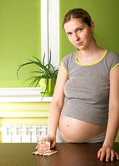 Image showing Cute Pregnant Woman On Kitchen