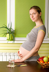 Image showing Cute Pregnant Woman On Kitchen