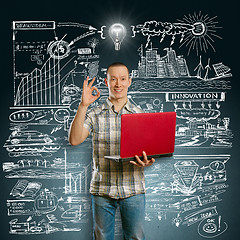 Image showing Idea Concept asian male with laptop in his hands shows OK