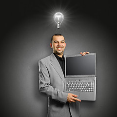 Image showing Idea Concept businessman with open laptop in his hands