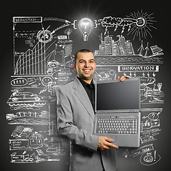 Image showing Idea Concept businessman with open laptop in his hands