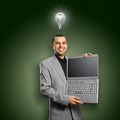 Image showing Idea Concept businessman with open laptop in his hands