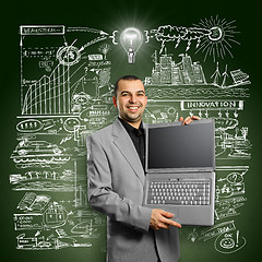 Image showing Idea Concept businessman with open laptop in his hands