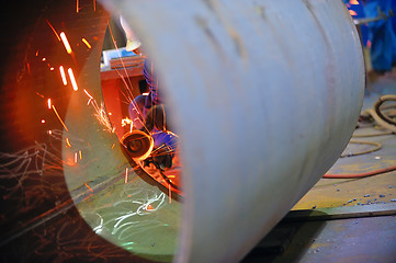 Image showing naval welder with protective mask welding metal 