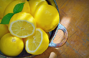 Image showing fresh lemons on a wood table