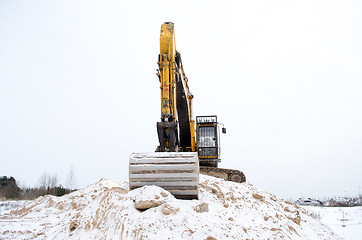 Image showing excavator pile sand pit soil snow winter industry 