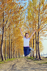 Image showing Happy girl jumping 