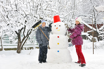 Image showing snowman and kids