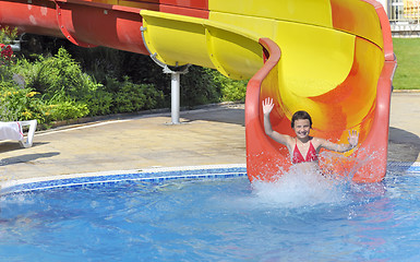 Image showing girl in the pool water slide 