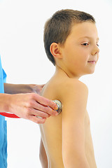Image showing boy having health check with stethoscope in hospital 