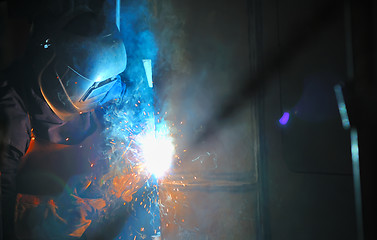 Image showing Industrial worker welding in factory