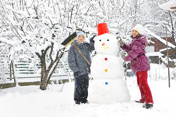 Image showing snowman and kids