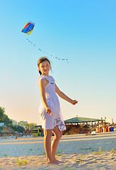 Image showing Girl on beach with kite 