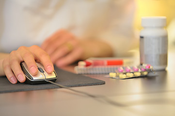 Image showing hand of doctor operating mouse 