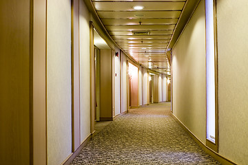 Image showing Long curved hallway

