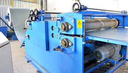 Image showing machine for rolling steel sheet in warehouse 