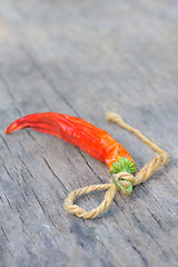 Image showing Red chili peppers over wooden background 