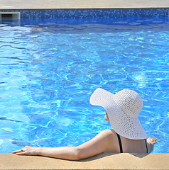Image showing Woman sitting in a swimming pool