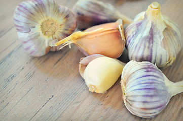 Image showing Garlics on old wood