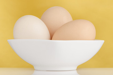 Image showing Three eggs in the bowl 