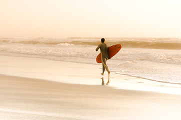 Image showing Surfer running