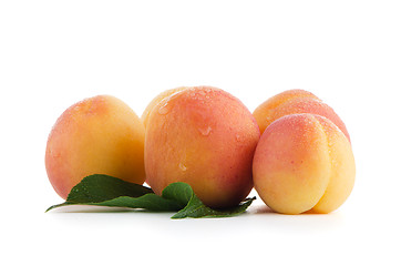 Image showing Sweet peaches with leafs