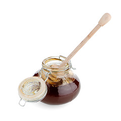 Image showing Jar of honey with wooden drizzler