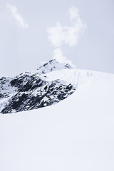 Image showing Snowed mountain summit and rocks in Himalaya