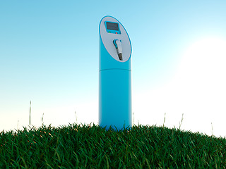 Image showing Charging station and green field at dawn