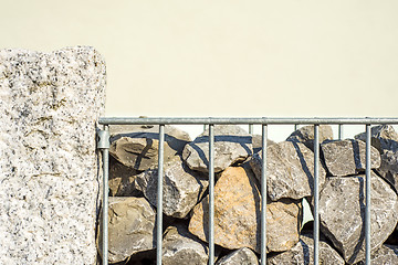 Image showing steel fence with stones