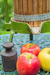 Image showing apples with old fruit press