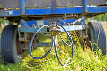 Image showing old trailer hidden in the grass