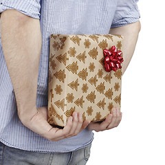 Image showing Young man holding a present