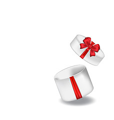 Image showing Open gift box with red bow isolated on white background