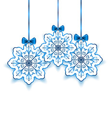 Image showing Set Christmas paper snowflakes with bow isolated on white backgr