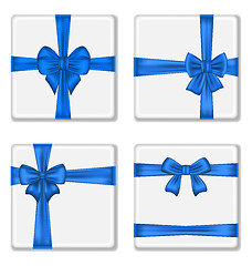 Image showing Set gift boxes with blue bows isolated on white background